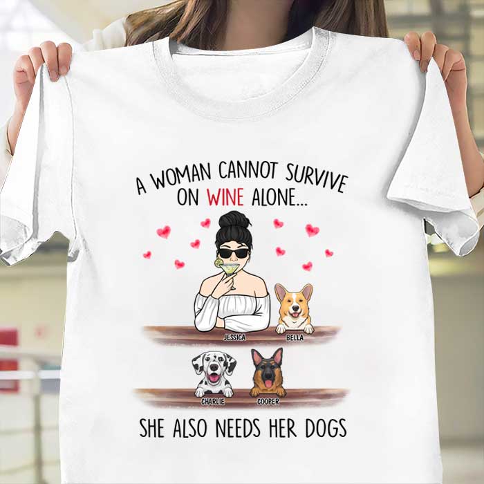 A Woman Cannot Survive On Wine Alone, She Also Needs Her Dogs - Personalized Unisex T-Shirt.